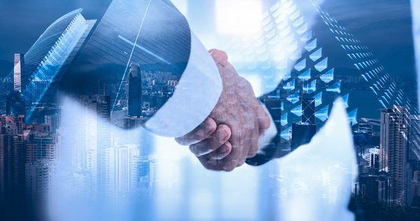 Two business partners shaking hands